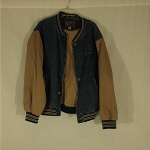 vintage denim jacket with tan sleeves team us west making life better here